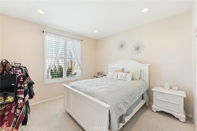 bedroom featuring recessed lighting, baseboards, and light carpet