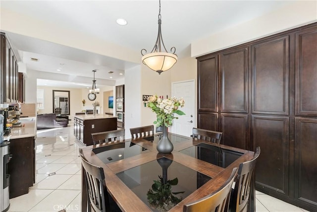 dining room with light tile patterned flooring and recessed lighting