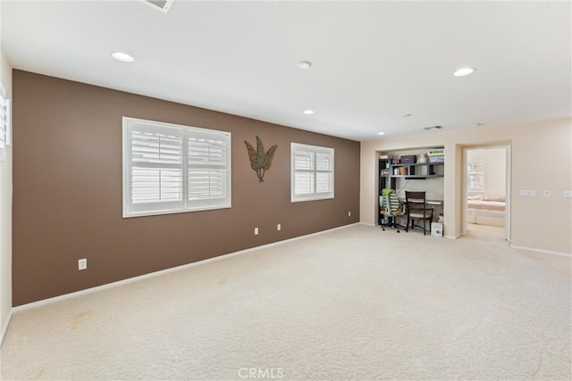 interior space with visible vents, recessed lighting, baseboards, and light carpet