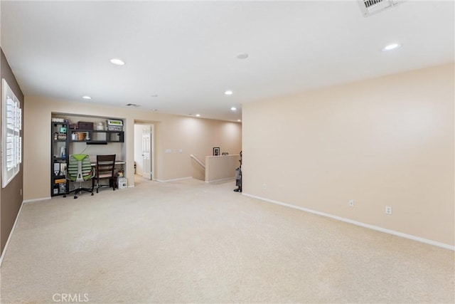 interior space with visible vents, recessed lighting, light colored carpet, and baseboards