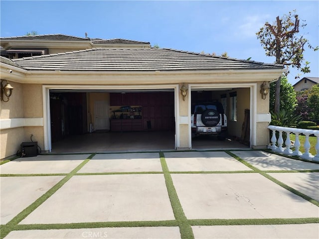 garage with concrete driveway