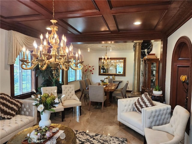 living room featuring coffered ceiling, an inviting chandelier, ornamental molding, and ornate columns