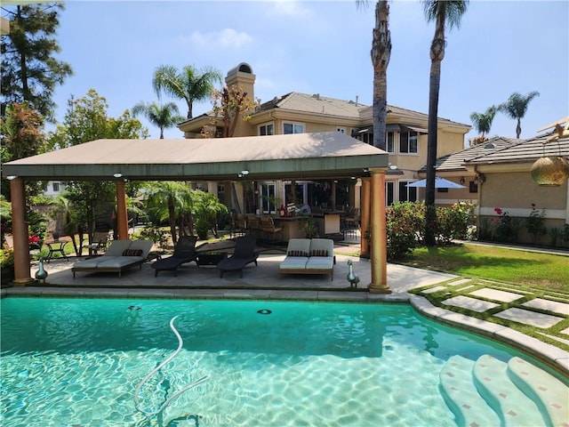 pool featuring a patio area