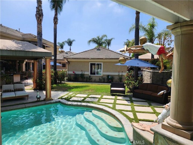 view of swimming pool with a patio area