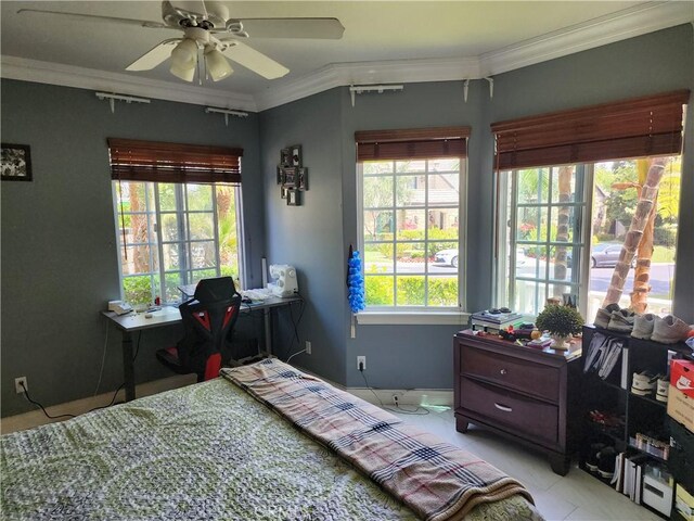 bedroom with ceiling fan and ornamental molding