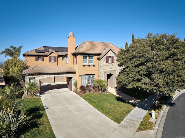 view of front of home featuring driveway, stucco siding, stone siding, a tile roof, and roof mounted solar panels