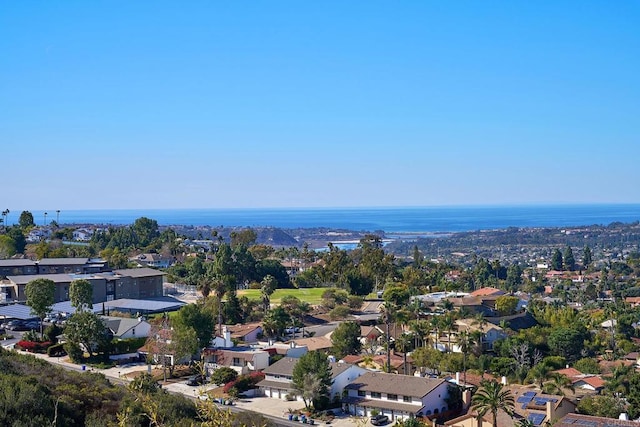 drone / aerial view featuring a residential view and a water view