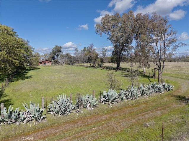 view of yard with a rural view