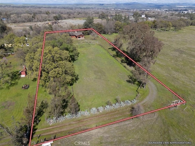 birds eye view of property featuring a rural view