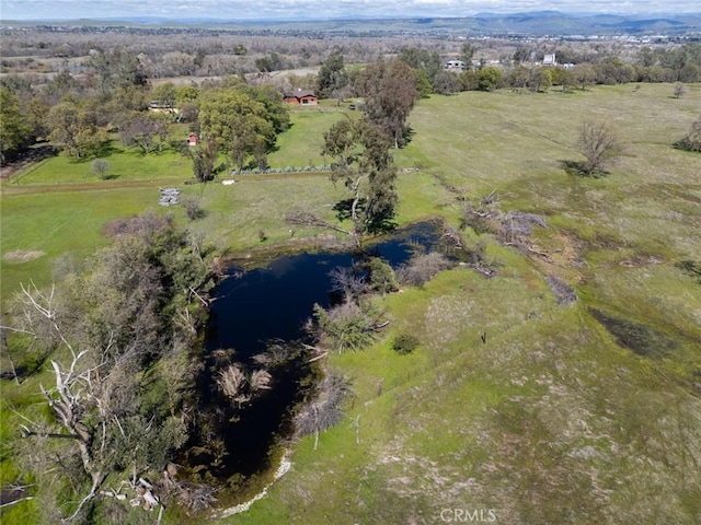 aerial view featuring a rural view and a water view