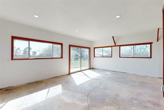 empty room featuring recessed lighting and concrete flooring