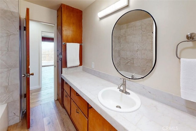 bathroom featuring vanity and wood finished floors