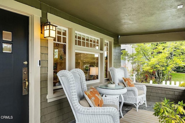 wooden terrace featuring a porch