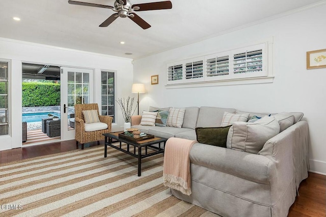 living room featuring a ceiling fan, crown molding, recessed lighting, and wood finished floors