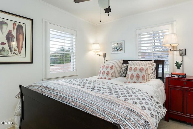 bedroom featuring crown molding and ceiling fan