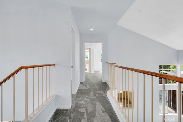 corridor with an upstairs landing, carpet, and recessed lighting