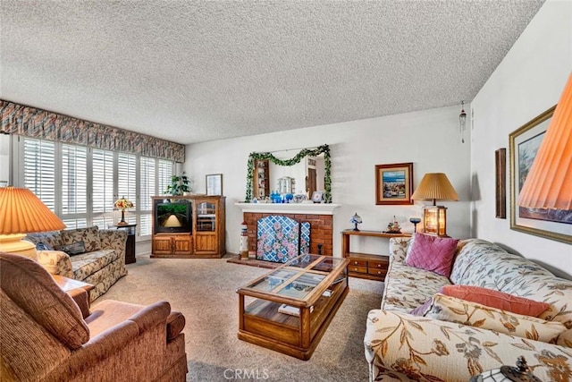 living room featuring carpet floors, a textured ceiling, and a brick fireplace