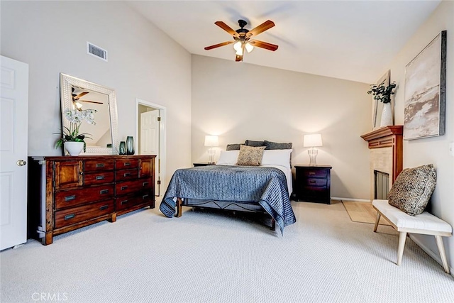 bedroom featuring a fireplace, visible vents, carpet floors, and high vaulted ceiling