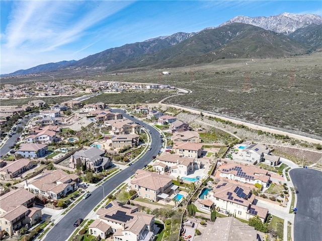 birds eye view of property with a residential view and a mountain view