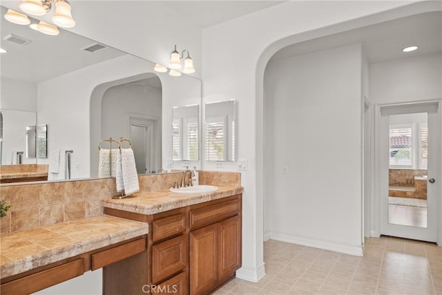 full bath featuring recessed lighting, visible vents, and vanity