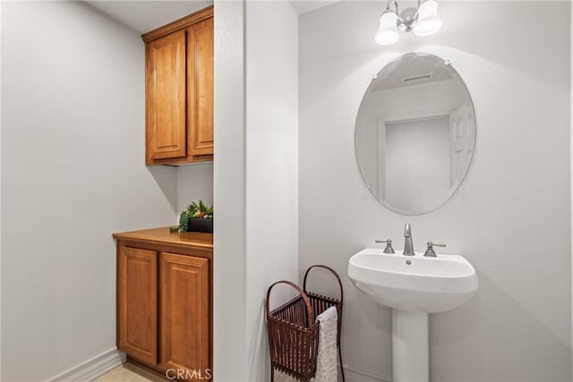12680 Encino Ct, Rancho Cucamonga, CA 91739 - bathroom with baseboards and a sink