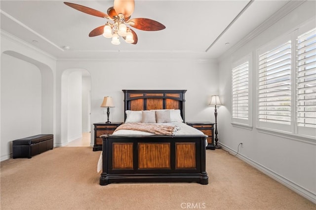 bedroom featuring light carpet, arched walkways, crown molding, and baseboards