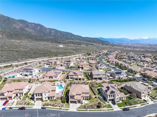 aerial view with a mountain view and a residential view