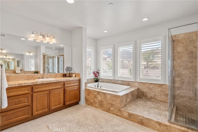 full bath with vanity, recessed lighting, a stall shower, tile patterned flooring, and a garden tub