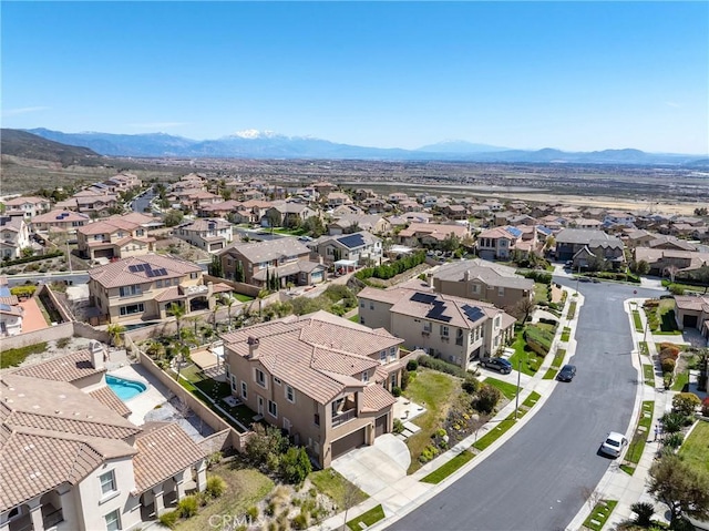 drone / aerial view with a residential view and a mountain view