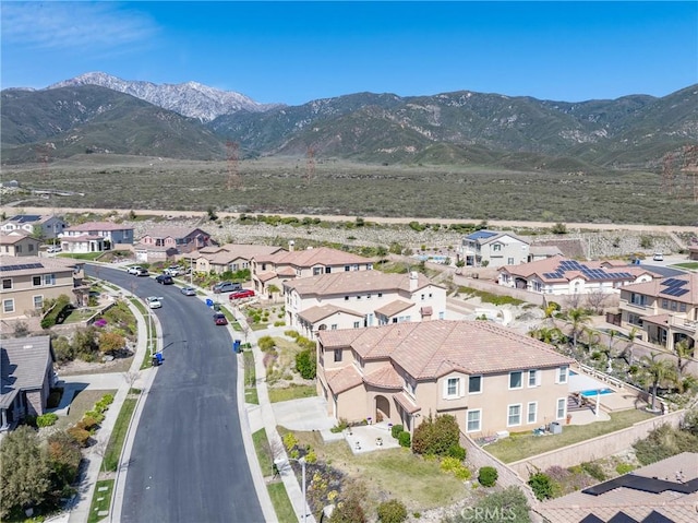 birds eye view of property with a residential view and a mountain view