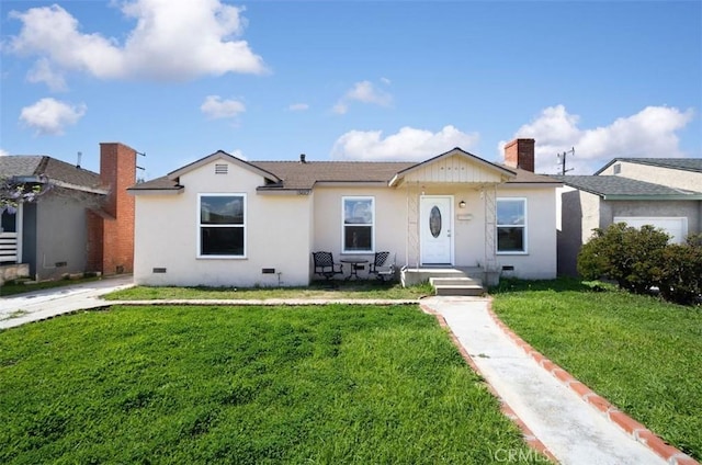 ranch-style house with a front yard and a chimney