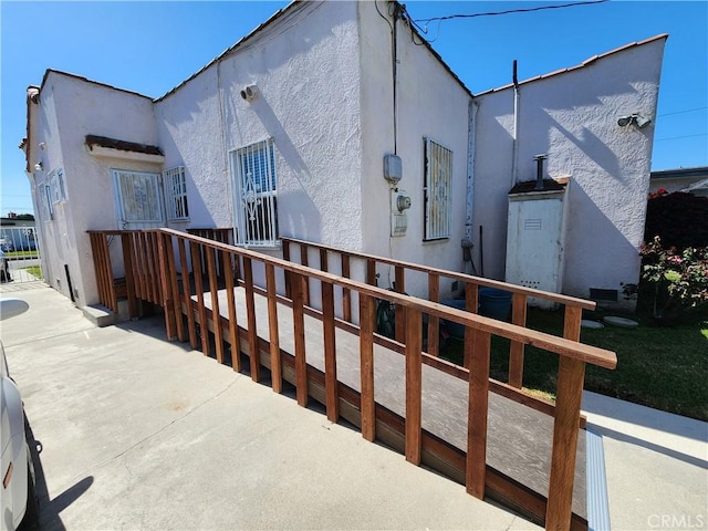 back of house with stucco siding