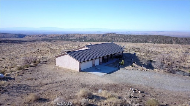 bird's eye view featuring a mountain view and view of desert