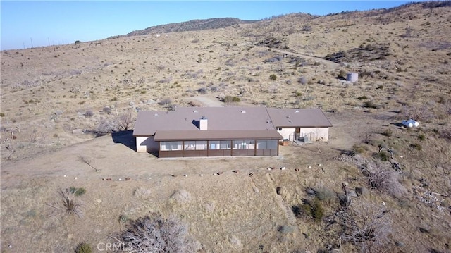 bird's eye view featuring a mountain view and view of desert