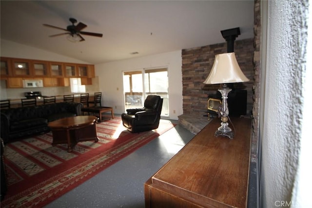 living room with lofted ceiling and ceiling fan