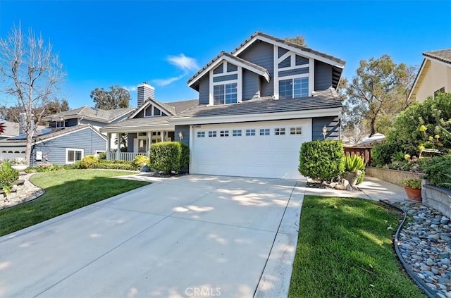 43966 Highlander Dr, Temecula, CA 92592 - view of front of house featuring concrete driveway, a front yard, an attached garage, a tile roof, and covered porch