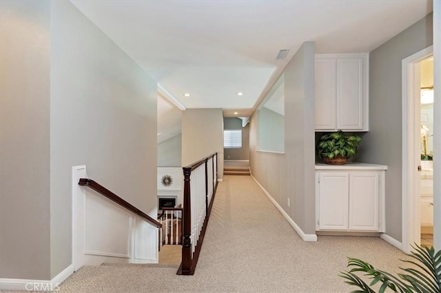 43966 Highlander Dr, Temecula, CA 92592 - hallway with an upstairs landing, light carpet, and baseboards