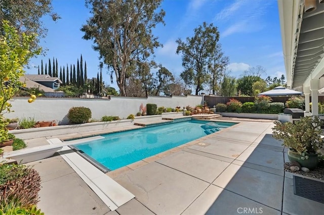 43966 Highlander Dr, Temecula, CA 92592 - view of swimming pool with a patio, a diving board, a fenced backyard, and a grill