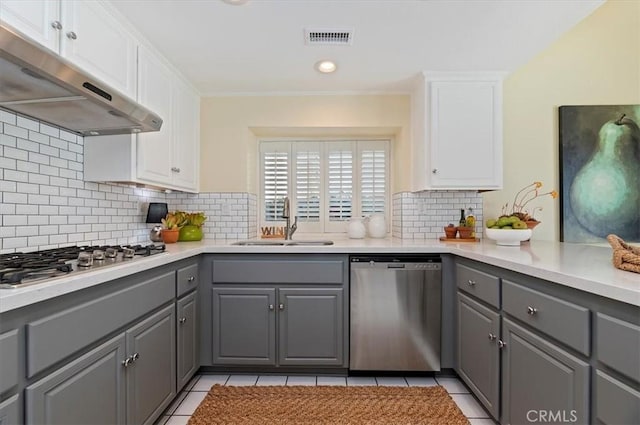 43966 Highlander Dr, Temecula, CA 92592 - kitchen with stainless steel appliances, gray cabinetry, under cabinet range hood, and light tile patterned flooring