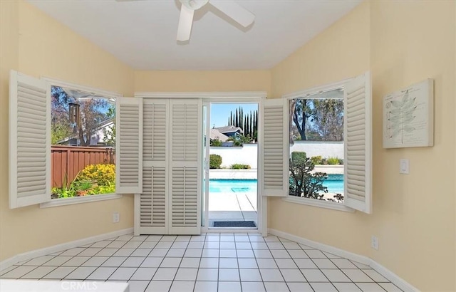 43966 Highlander Dr, Temecula, CA 92592 - entryway featuring ceiling fan, baseboards, tile patterned floors, and lofted ceiling