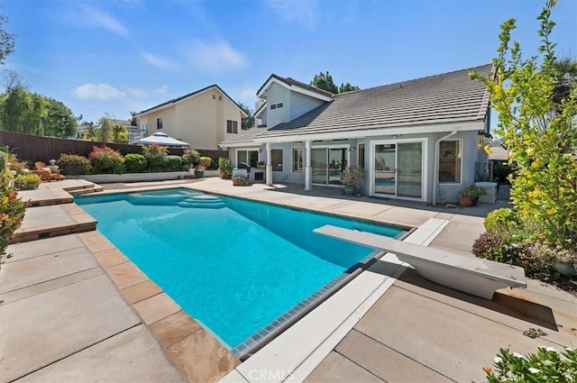 43966 Highlander Dr, Temecula, CA 92592 - view of swimming pool with a patio, a fenced backyard, and a diving board