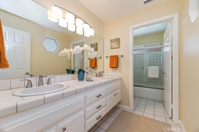 43966 Highlander Dr, Temecula, CA 92592 - bathroom with double vanity, tile patterned flooring, enclosed tub / shower combo, toilet, and baseboards