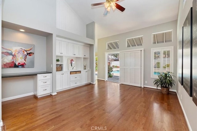 43966 Highlander Dr, Temecula, CA 92592 - unfurnished office featuring ceiling fan, a towering ceiling, baseboards, and wood finished floors