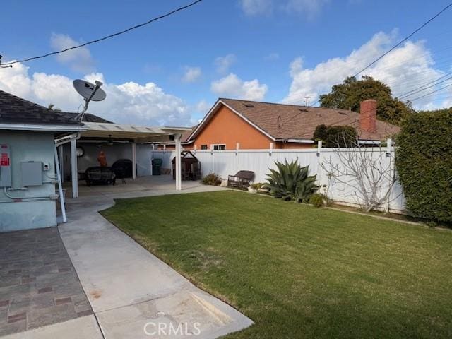 view of yard with a fenced backyard and a patio area