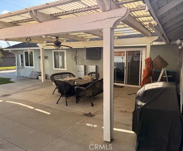 view of patio / terrace featuring outdoor dining space, a ceiling fan, a pergola, and grilling area