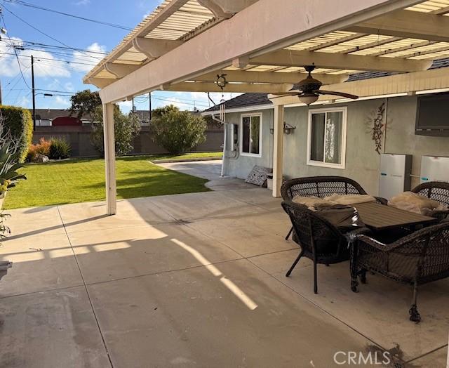 view of patio / terrace with a pergola, ceiling fan, and fence