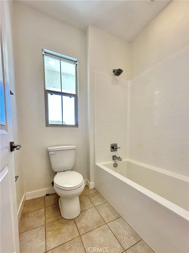 full bath featuring tile patterned floors, toilet, shower / tub combination, and baseboards