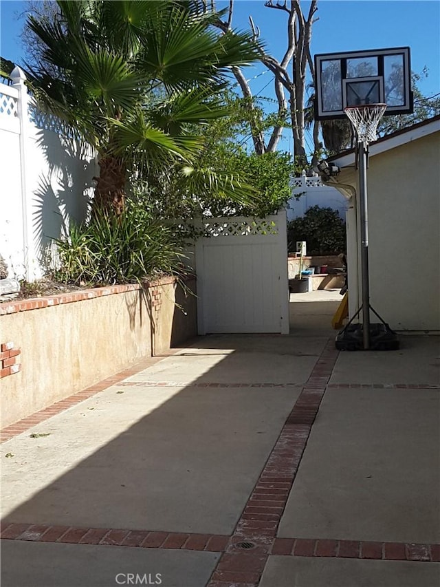 view of patio featuring fence