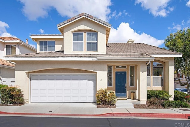 view of front facade featuring stucco siding, an attached garage, driveway, and a tiled roof