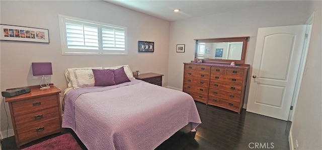 bedroom featuring dark wood-style floors and recessed lighting